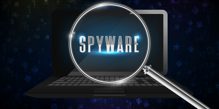 Magnifying glass by the computer detecting spyware