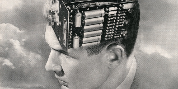 A retro photo of a man with a circuit board in his brain.