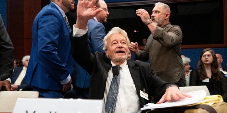 George Knapp in Congress, waving.