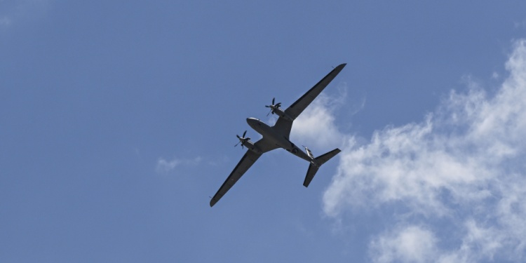 A plane flying like a drone overhead.