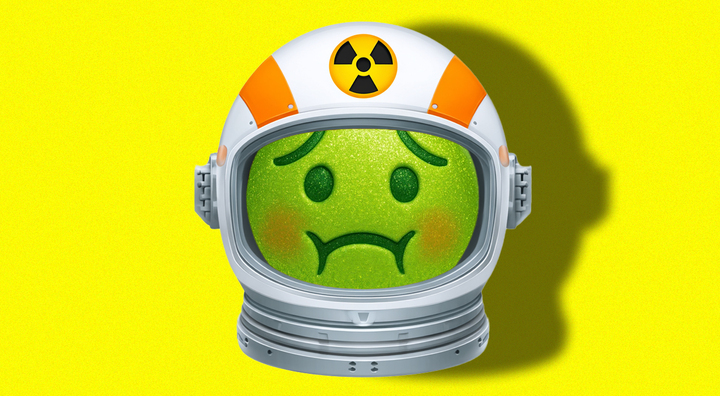 green sick emoji face in space suit helmet with yellow radiation logo