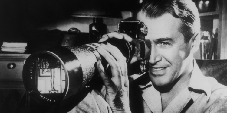 James Stewart with a huge camera in Rear Window.