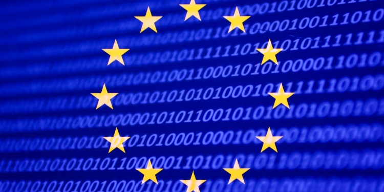 The EU flag placed on a screen full of code.