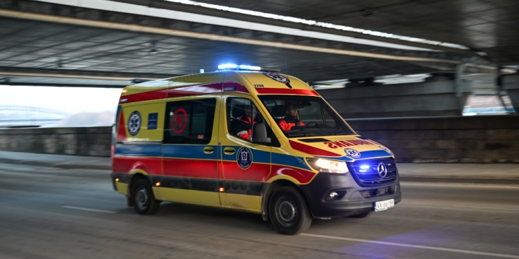 An ambulance driving to an accident.