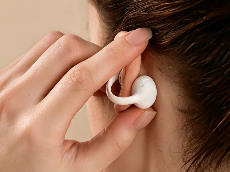 Woman wearing Baseus Bowie MC2 earbuds