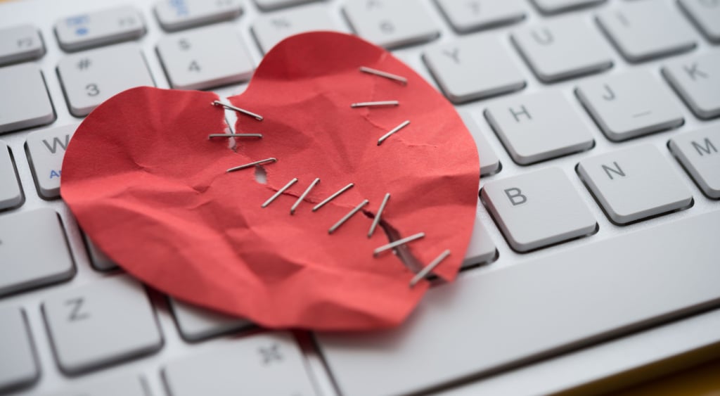Romance scam heart and keyboard