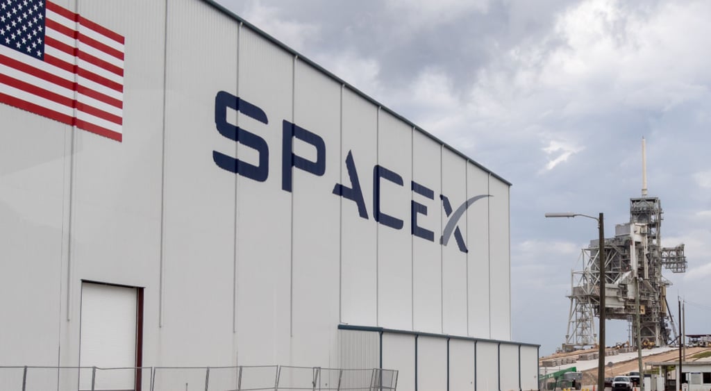 Space X building w logo and American Flag
