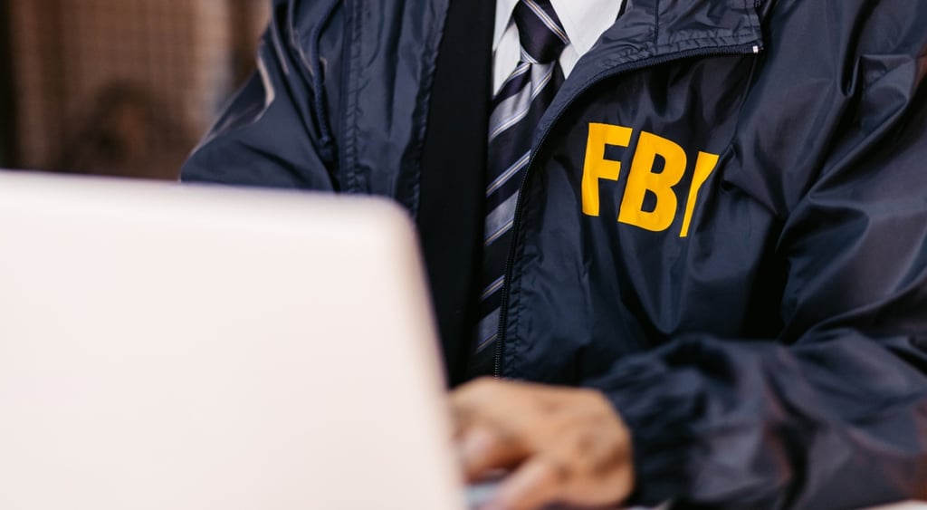 FBI Detective Using Laptop In His Office