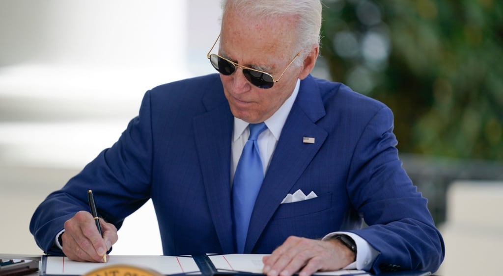 Joe Biden signing a document.