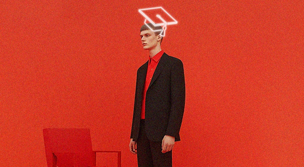 man in black suit, red shirt with digital graduation cap