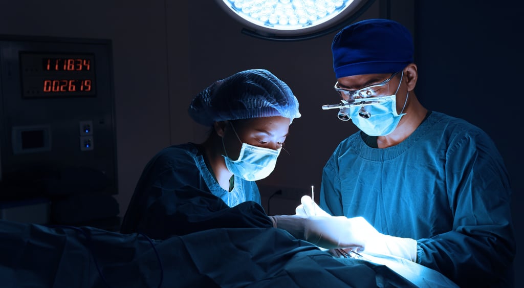 Partner content two people performing surgery