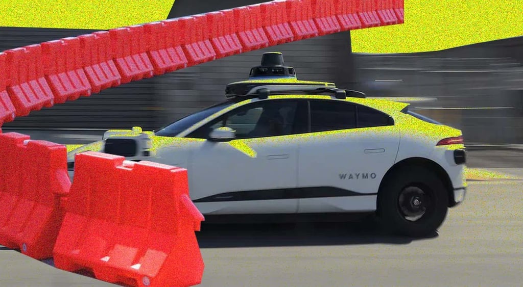 A Waymo self-driving car; road barriers