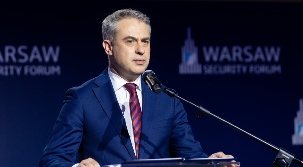 Krzysztof Gawkowski, man with grey hair in blue suit, microphone