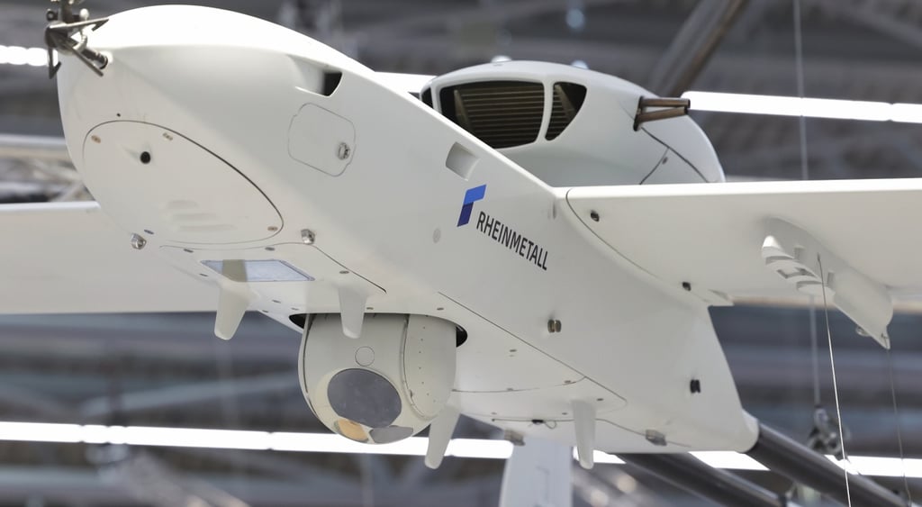 Rheinmetall logo on body of white plane