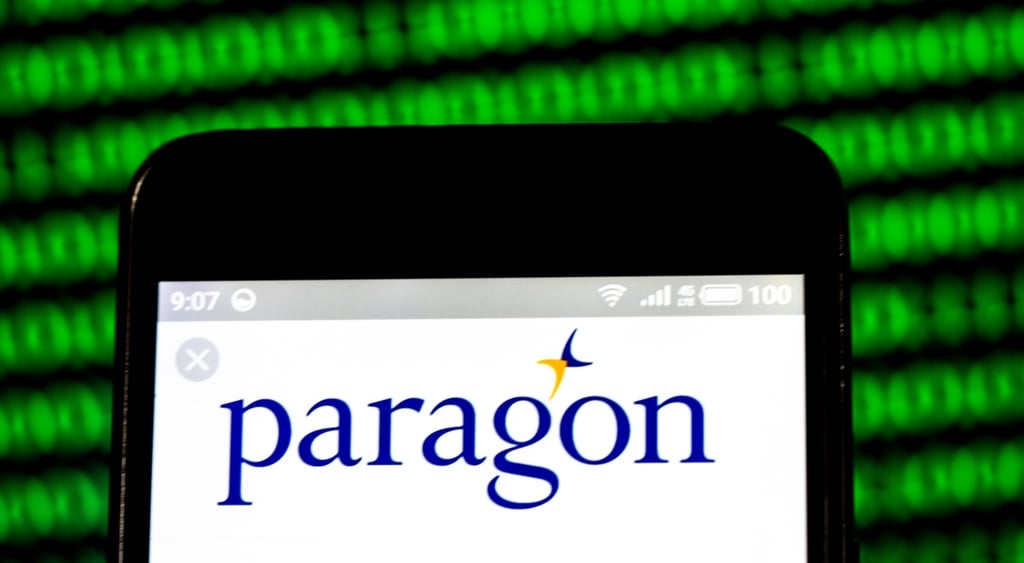 Paragon logo on white phone screen and matrix like background with green numbers