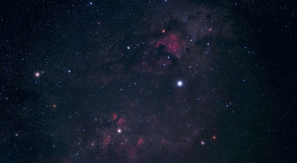 starry night sky with purple spots, bright bigger stars