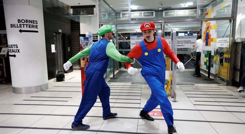 two men with moustache dressed as super mario dancing