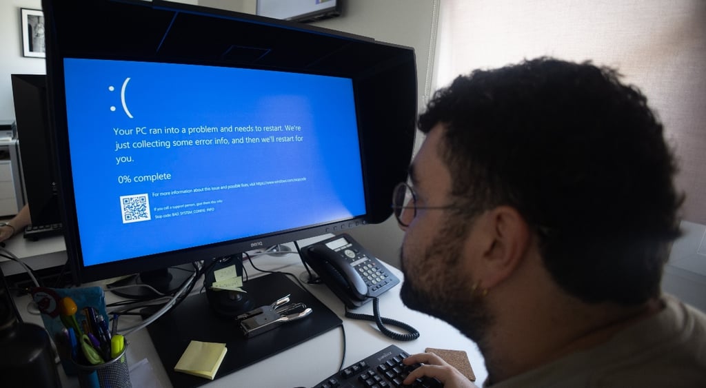 A computer displaying a Windows error screen, a.k.a Blue Screen of Death