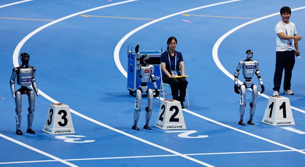 Humanoid robots take part in a 100m test run in robot games in Beijing, China