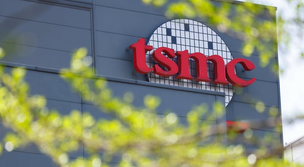 tsmc grey building, green tree branches, ed sign tsmc