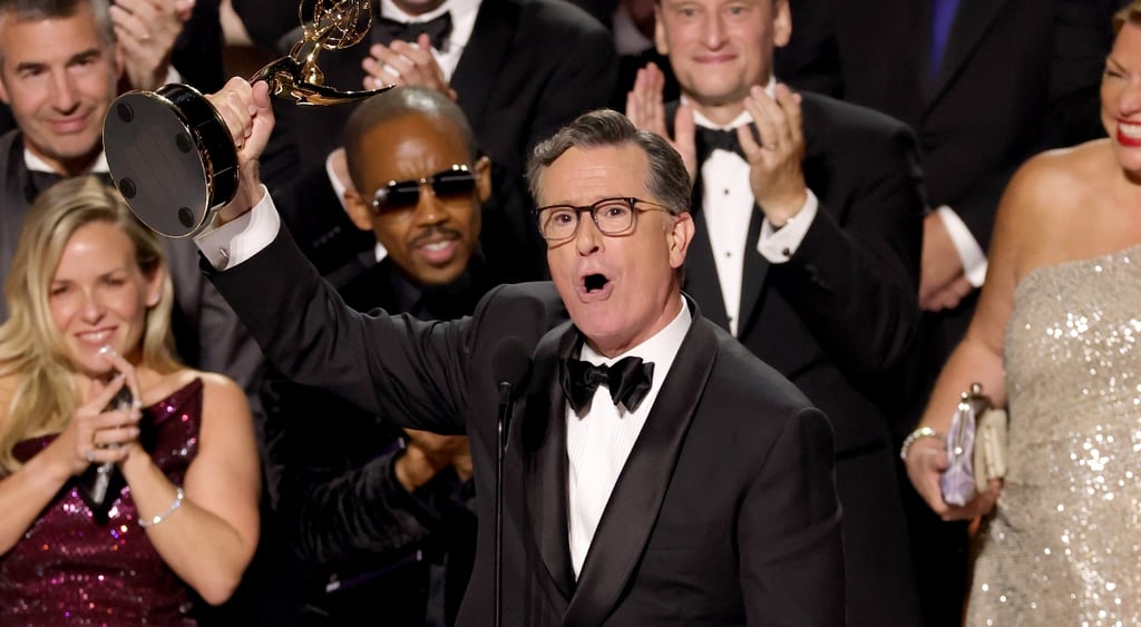Stephen Colbert accepts an Emmy award for his late night show