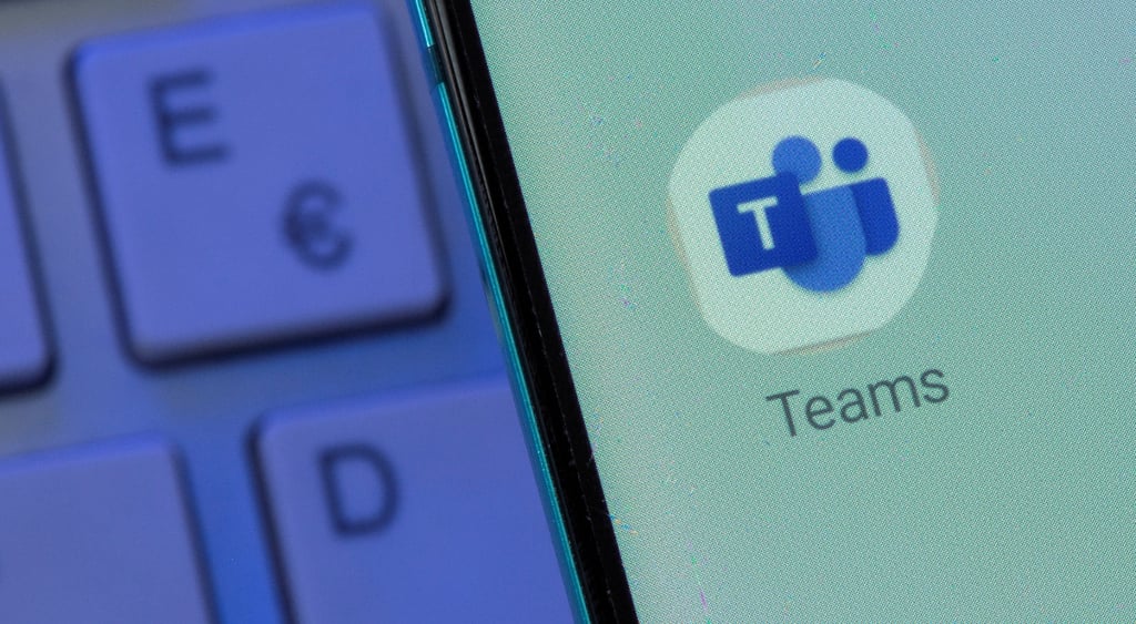 A logo of Microsoft Teams with keyboard in the background
