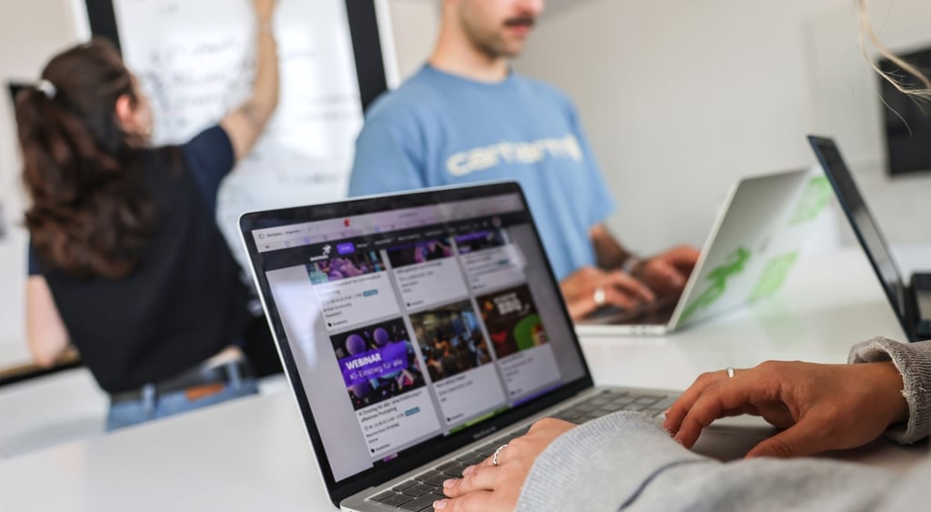Office workers at their laptops