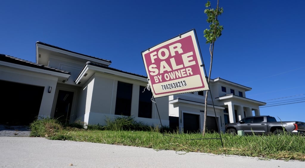 For sale sign in front of a house