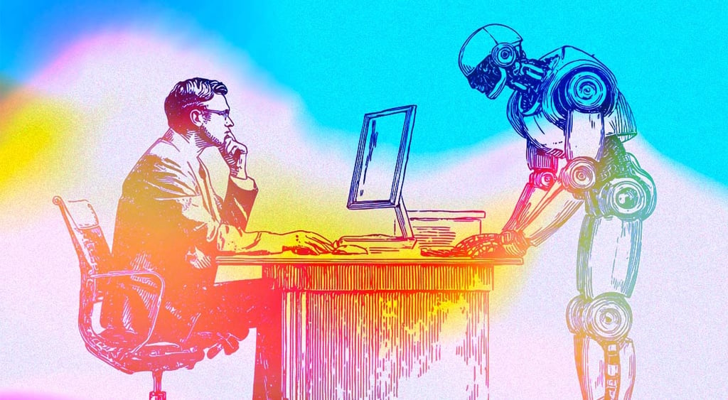 A person sitting at the desk looking at the computer screen and a robot working