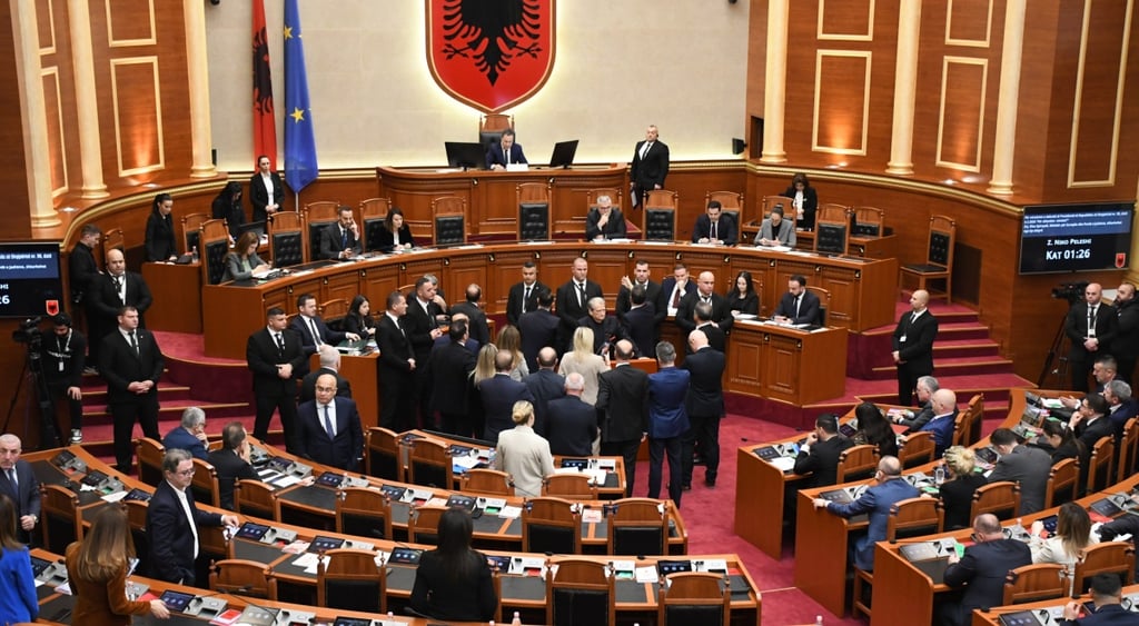 albania, parliament, people in suit gather in room centre, albanian flag
