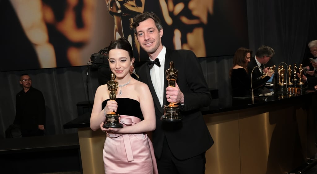 Mikey Madison black suit, white shirt, Alex Coco, pink and black strapless dress, oscar statue