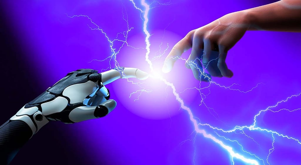 A human hand touching a robotic one.