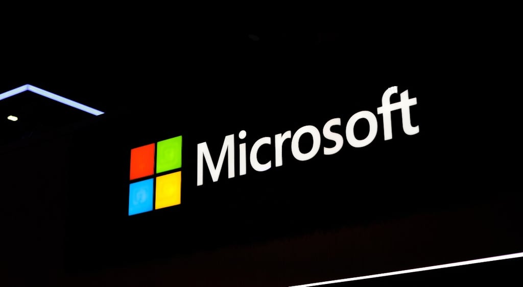 The Microsoft corporate logo is illuminated at the Fira Gran Vi