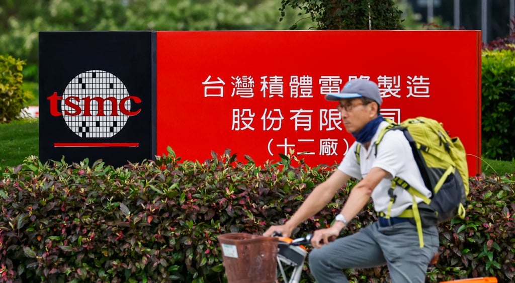 tsmc red and black outdoor stand, cyclist in front, yellow backpack