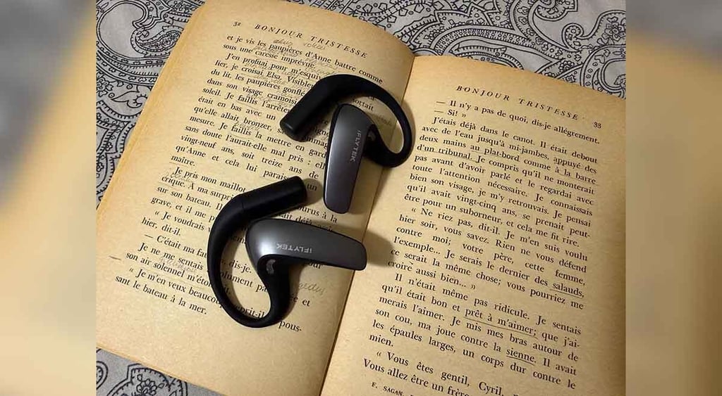 Book and iFLYTEK AI translation earbuds
