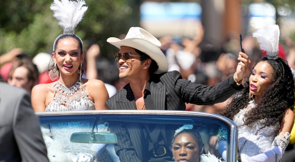 Bruno Mars in a car with dancers at Las Vegas Parade