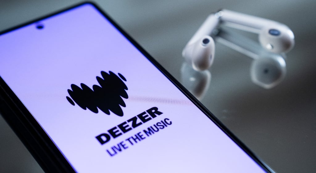 The Deezer logo is displayed on a smartphone screen next to wireless earbuds