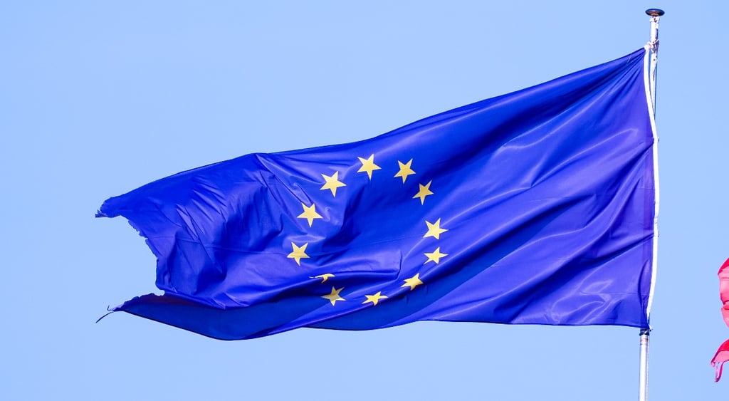 A European flag is displayed in Italy