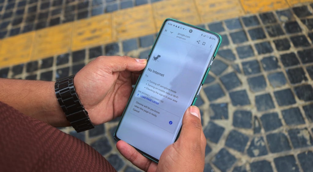 brown skin man hands, smartphone, white screen, dinosaur, no internet sign