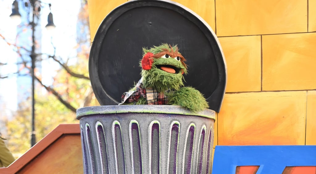 Oscar Grouch, grey trash bin, swamp green fur, yellow bricks
