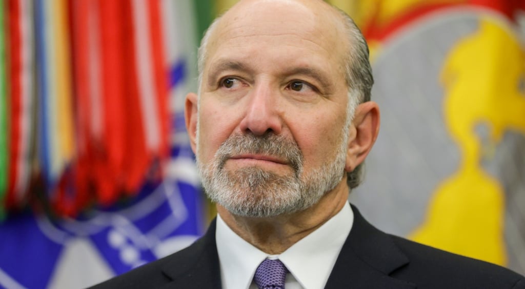 old man, bald forehead, grey moustache, white shirt, blue tie, howard lutnick