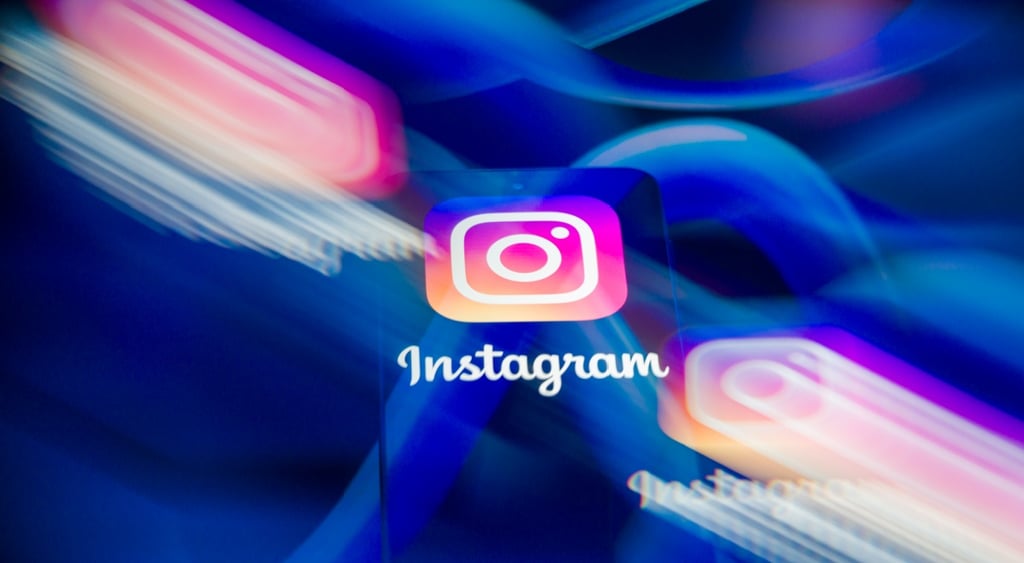 three instagram logos, two blurry, meta logos, the blue infinity signs, in the background