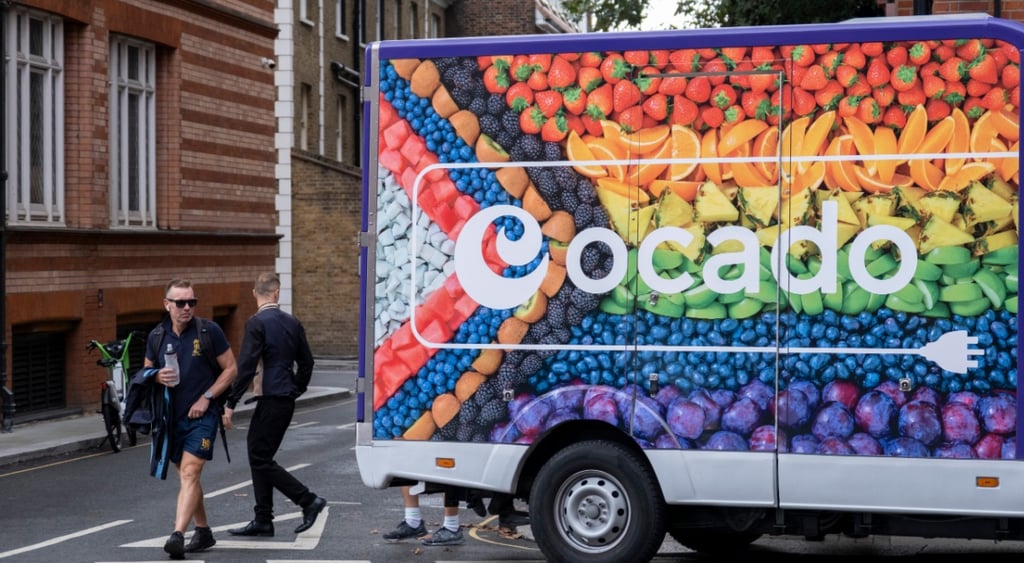 food van, oranges, blueberries, strawberries, two men, black jeans, shorts, black tires