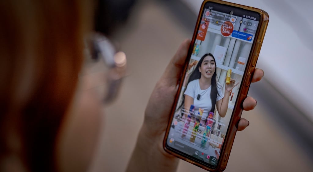 tiktok stream, asian woman on smartphone screen, long black hair, skincare, glasses