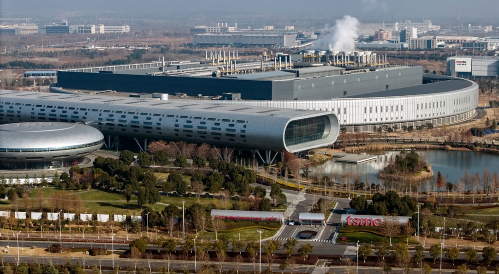 tsmc manufacturing facility, big round pool, oval shaped grey building