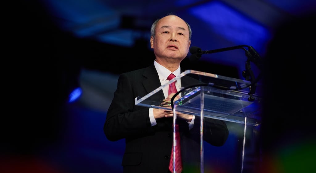 middle aged bald asian man, black suit, red an white stripes tie, white collar shirt,