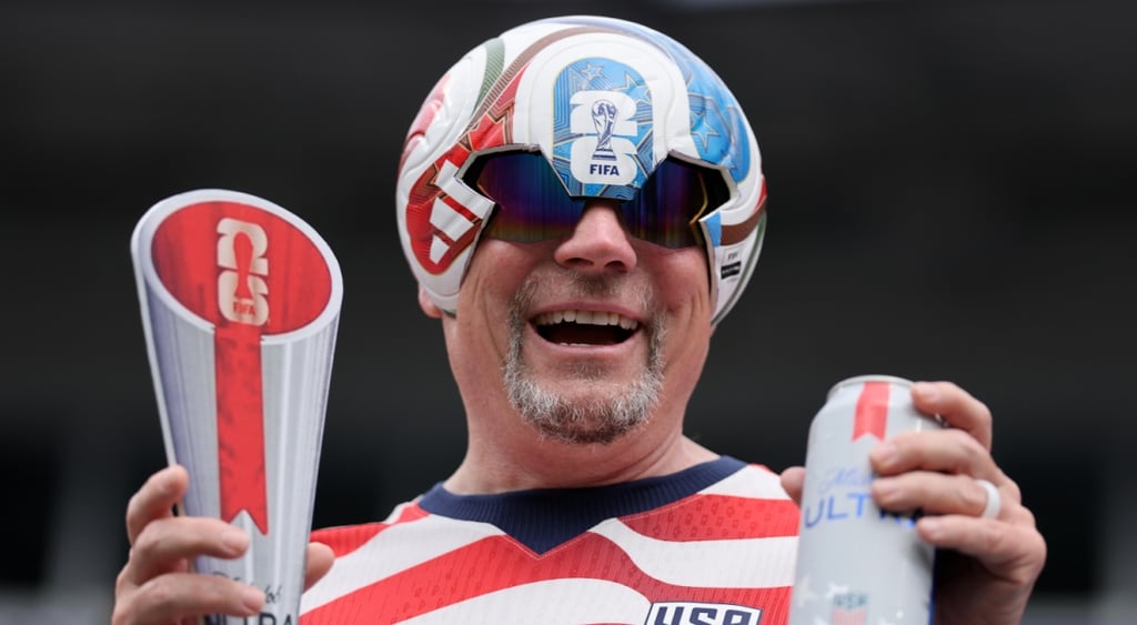 old man, grey goat beard, fifa world cup ball that's a helmet, smiling, the winners cup