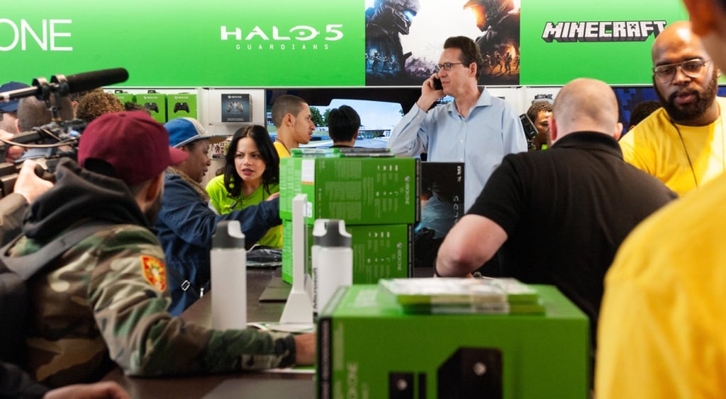 People in store buying Xbox