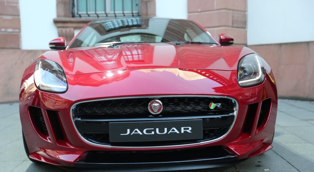 Jaguar C-X75, red car, black licence plate with jaguar sign