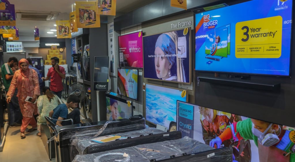 people walk near smart tv display, yellow discount sign, Girl with a pearl eerring painting on screen